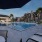 a pool with a deck and chairs