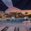 a swimming pool in front of a building