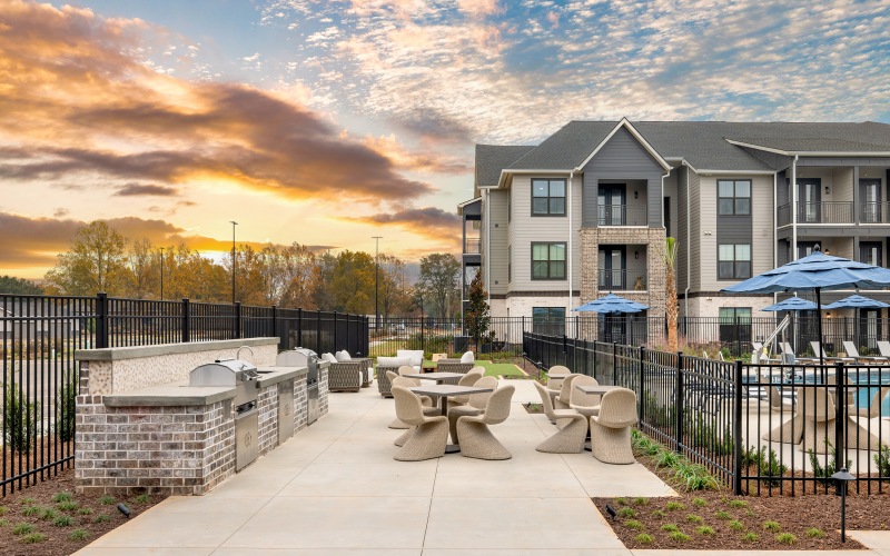 Outdoor Dining Lounge with Lawn Games and Grills