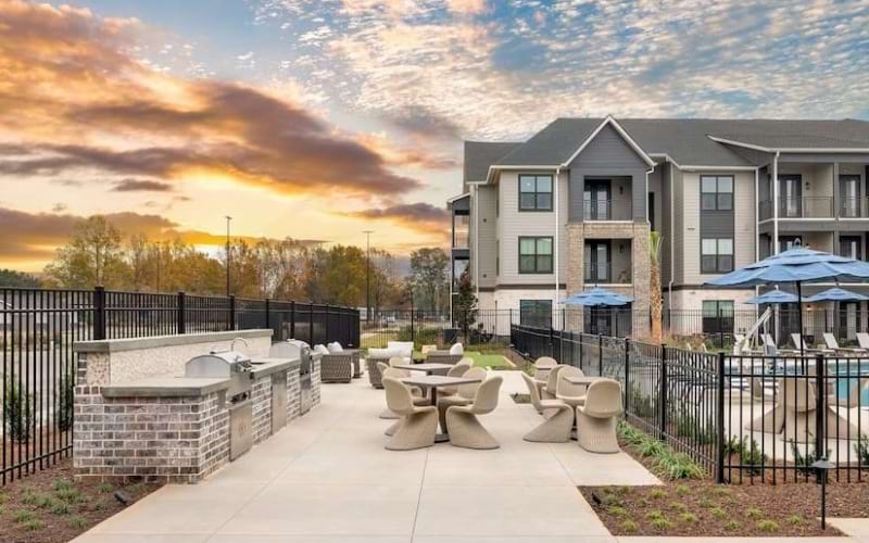 Outdoor Dining Lounge with Lawn Games and Grills