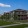 a building with a lawn and trees