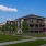 a building with a lawn and trees