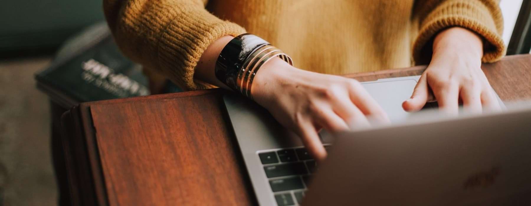 a woman typing on a computer